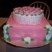 100_3934.jpg This was a cake for my Mother- n- law and Niece's birthday. Its a white cake with strawberry flavored icing except the white frosting...