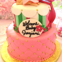 Girl Baby Shower Cake I just love making little fondant babies! Instead of wrapping a diaper around the figure, it's easier to make a cute little blanket.