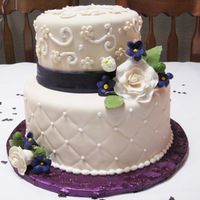 Wedding Shower Flowers and leaves all made out of gumpaste. The colors were purple and ivory.