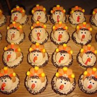 Turkey Cupcakes!! These are from a fantastic cupcake book I have. Really fun to make, and HILARIOUS to look at! It's funny seeing an army of turkeys...