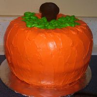 Pumpkin Cake I made this for a fall festival at my church. Two bundt spice cakes inverted on each other.