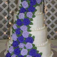 Brandy's Cake Yellow Cake, Cream cheese icing filling, with RI roses in two shades of purple. In the pic. its looks blue, but it was purple.