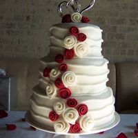 10-21-2007_026.jpg White cake, BC Icing Filling and cover in Fondant. Rolled Fondant Roses.