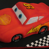 Lightning Mcqueen The famous car. Made in yummy chocolate cake for a lucky 4-year-old.