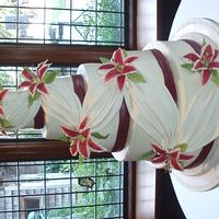 5 Tier Wedding Cake With Draping And Stargazer Lilies 5 tier buttercream wedding cake with fondant riboon, draping and gumpaste stargazer lillies