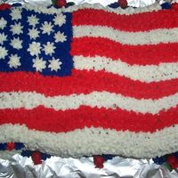 Flag Cake Its got a few holes but the camera really makes them stand out! in person it doesnt look like a "holey" flag. LOL This is cake #3...