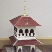 Pagoda Cake I made this for my Husband's Black Belt Cermony. The roof is Gumpaste, "glued" together with almond bark. The top Cake is a...