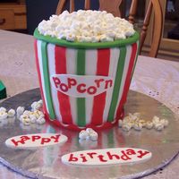 Christmas Carnival Popcorn Cake! for a two-year old's birthday. the theme was a christmas carnival. used SMbuttercream, MMF, Fruit by the Foot (red stripes) and...