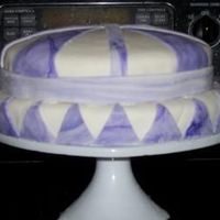 1St Cake Ok i know its not perfect. this is the first time Ive ever tried to make a cake using Fondant and I dont own any tools . But i think I did...