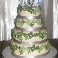 Karen's Wedding Cake Four tier wedding cake red velvet two layers, design based on peggy porschens four tier wedding cake. Covered in ivory fondant. Flowers are...