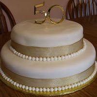 50Th Anniversary Both cakes are yellow with raspberry filling and almond buttercream, covered with fondant. The balls/pearls are also fondant (hand-rolled...