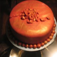 Img_2046.jpg My first fondant cake. The top decorations and the beads around the base are all fondant. I found the fondant to be really tough when it...