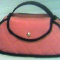 Pink Purse Cake This is a red velvet cake covered with MMF. I saw this cake on youtube and gave it a shot. I think it turned out ok.