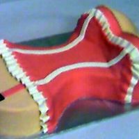 Bustier Cake 2-layer Chocolate cake , frosted with buttercream and covered with MMF.