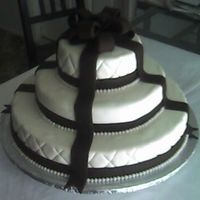 Ivory/chocolate Wedding Cake I made this cake as a wedding gift for my friend. 1st. wedding cake ever. Not too happy with the way it turned out, but happy to finish it...