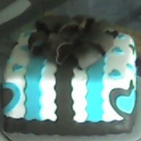 Hearts And Ribbons 3-layer chocolate cake, frosted with buttercream and covered with fondant.