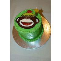 Sock Monkey first birthday cake - vanilla cake/buttercream; sock monkey face made from candy melts