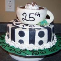 Coffee_Cup_Anniversary_Cake.jpg 10 " round and the cup was molded and covered in fondant, B.C. swirl with chocolate shavings.