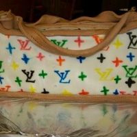 L.v. Purse chocolate cake coveredin mmf and hand drawn symbols