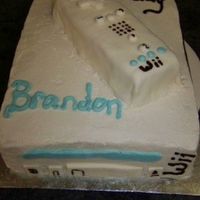 Wii System 9x13" pan with a piece cut off for the controller. Controller covered in fondant and the system is covered on buttercream.