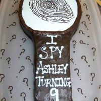 Magnifying Glass 10" round with a cake handle. This was for my daughter's detecive party.