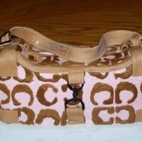 Coach Purse this is a chocolate cake with buttercream icing. The "c"'s are all hand drawn. The strap and corners are MMF.