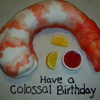 Colossal Shrimp Cake Shrimp is yellow cakes covered in MMF painted with food gel.Lemons are MMF painted with food gel.Cocktail sauce is red BC with cake crumbs...