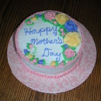 Happy Mother's Day Cake Buttercream icing and decorations, cinnamon swirl cake. Hersery's kisses for the center of three roses. Got the idea off of some...