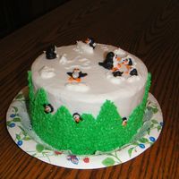 Playful Penguins This was a donation cake for a bake sale and I had just taught a penguin cake class the day before. Just having fun with icing.....