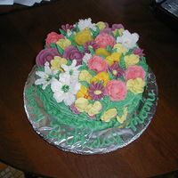 Mom's Birthday Cake My mom loves flowers, so I used up all of the remaining flowers from class. Mostly all in royal.