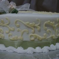 Scrolls With Gumpaste Flowers This is the side of the small anniversary cake that I made. I love the tone on tone. It showed up darker than it really was. Cake turned...