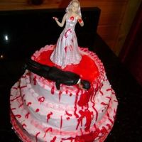 Divorce Cake This was for a girl that had a bad divorce. So very fun to do. Used piping gel for the blood and it was a strawberry cake with bc icing.