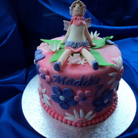 Blossom Fairy Cake Made this blossom fairy cake for a friend. Fairy is made with tylos powder mixed with fondant. Fun cake to decorate. Thanks for looking!