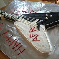 Electric Guitar Buttercream with fondant accents and royal "strings" and outline. It was difficult to get a smooth buttercream icing finish...i...