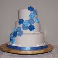 Second Wedding Cake / Blue Cascading Flowers This was a fruit cake covered in marzipan and fondant. The cresanthenums were made from royal icing. I was happy with with one and so were...