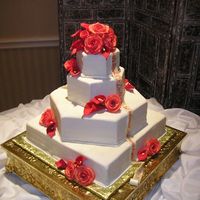 Gumpaste Roses And Calla Lilies This cake really challenged me. I didn't know how I was going to put the gumpste ribbon on the cake untill the last minute I figured...