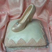 Glass Slipper On A Cake Pillow The shoe is done in white chocolate. It took for ever to carve out the inside of the shoe. Won't do that again. I think this cake...