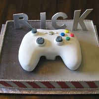 Xbox 360 The controller is in fondant and the rest is buttercream with fondant accents. the letters are gumpaste.