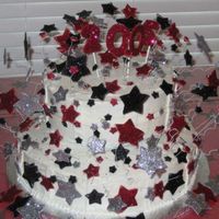 Graduation Stars I made a white cake and iced with buttercream. The stars are made of fondant mixed with gum paste and colored the different colors. I cut...