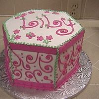 Pink Hexagon This is a white cake with White Chocolate mousse and raspberry filling. I used a hexagon pan and made 3 layers. I then cut each layer in...