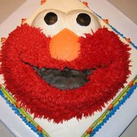 Elmo Cake (Ii) Elmo is a marble cake and red, red, red bc icing. The square layer is fresh lemon cake with blackberry filling.