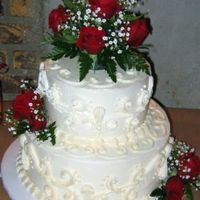 Red Roses And Scrolls This was a cake I did for a 40th Anniversary. The cake was butter with raspberry filling and whipped cream bc for icing and decoration. The...