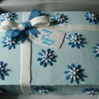 60Th Birthday WASC with raspberry mousse fililng. Buttercream with fondant accents. Thanks for looking!