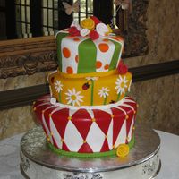 Nature's Whimsy - Amber's Cake 12-9-6 Topsy Turvy Cake. Inspired by colors of nature, the bride is a Botanist. Apple Red, Daffodil Yellow, Granny Smith Apple Green,...