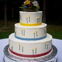 Country Daisies And Ribbons Three tier 14-10-7 inch round stacked wedding cake. Iced in vanilla buttercream. 3/4 inch fondant ribbon strips around base of each tier in...