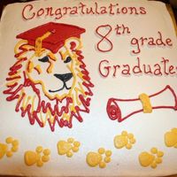 Graduation cake for school graduation. lion mascot. colors are red and gold. All buttercream