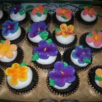 Aloha Cupcakes! wedding shower with a Luau theme. i made the flowers with the 5 petal rose cutter... dusted them after they dried with asst. colored petal...