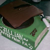 Graduation covered in fondant. Mortarboard made of candymelts b/c i did not have time to let fondant dry out!i like it! :)