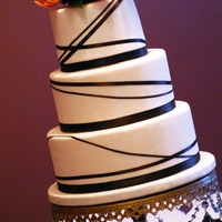 My First Wedding Cake! This is the very first wedding cake I have ever made. I'm happy with it over all, but definitely learned along the way. Cake is...