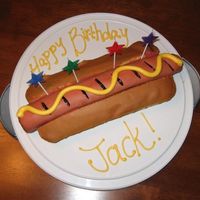 Hot Dog Cake I made this for my step-son's 3rd birthday. The "bun" is just un-iced pound cake. The "dog" is 3 twinkies iced in...